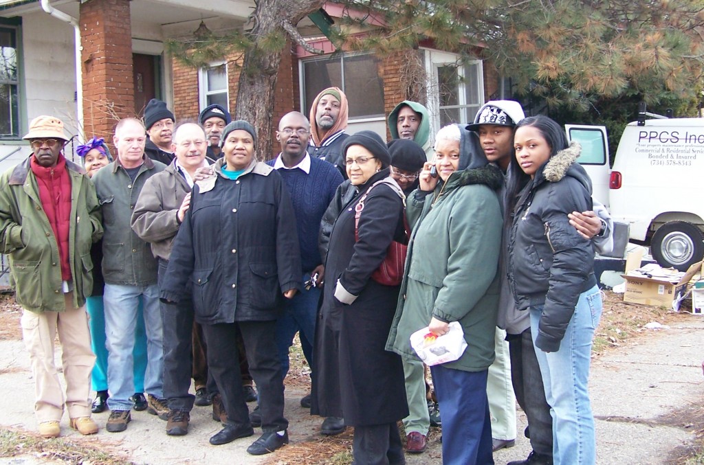 Anthony King (center) lived in his home 41 years, caring for his parents before their deaths there. Members of Moratorium NOW!, other groups and his neighbors moved him back in March 11, 2009, but he eventually lost his home, as have millions of others across Detroit and the U.S. King is featured in Michael Moore's movie, 'Capitalism: A Love Story." Photo by Diane Bukowski