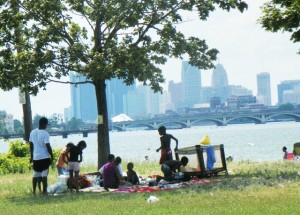Family picnics near Belle Isle beach with view of downtown Detroit July, 2012.