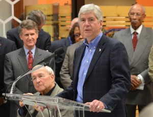 Gov. Snyder (center), shown with Detroit Mayor Dave Bing (l) and Oakland Co. Exec. L. Brooks Patterson, now dominates Detroit.