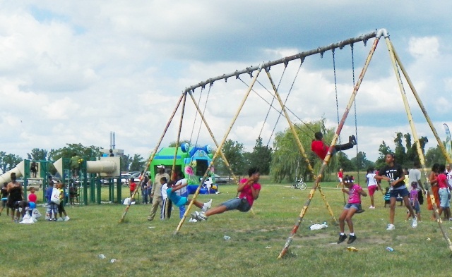 Detroit kids enjoy swings in Belle Isle Park, similar to those in many neighborhood  city parks Bing now wants to close.