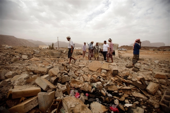 Tribesmen this week examine the rubble of a building in southeastern Yemen where American teenager Abdulrahmen al-Awlaki and six suspected al-Qaida militants were killed in a U.S. drone strike on Oct. 14, 2011. Al-Awlaki, 16, was the son of Anwar al-Awlaki, who died in a similar strike two weeks earlier. Khaled Abdullah / Reuters