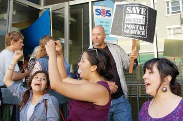 Postmaster General Donahoe today announced plans to eliminate Saturday letter delivery, starting in August. Activists in the Bay Area are among those waging a raucous fight to save the postal service from death by a thousand cuts. Photo: Patricia Jackson.