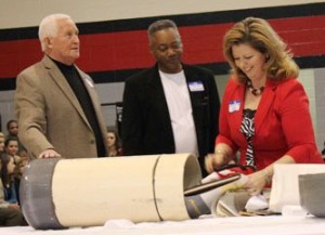 Bobby Harris (center) was previously assistant principal of Thompson High School in Alabaster, AL. He is shown here with others opening school time capsule.