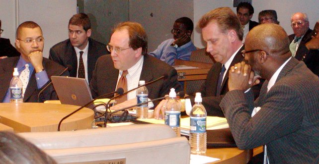 PREDATORY LENDING: Jan. 31, 2004: Wall Street ratings agenices reps Joe O'Keefe of Fitch Ratings (speaking), and Stephen Murphy of Standard and Poor's (to his left), foistied $1.5 BILLION loan on city of Detroit. Also shown in photo (l) then Detroit CFO Sean Werdlow, who left the Kilpatrick administation later that year to take a job with UBS 'minority partner Siebert, Brandford & Shank as managing director, and (r) then Deputy Mayor Anthony Adams. Photo by Diane Bukowski