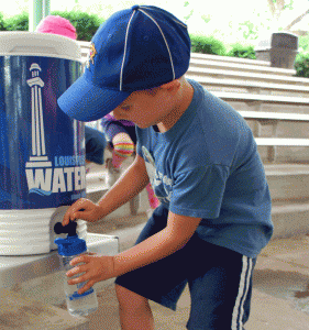 Boy gets drink from Louisville Water Co. cooler.