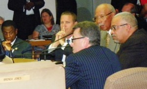 "Mike" McGee (back to camera) advises Bing et. al. on the consent agreement.