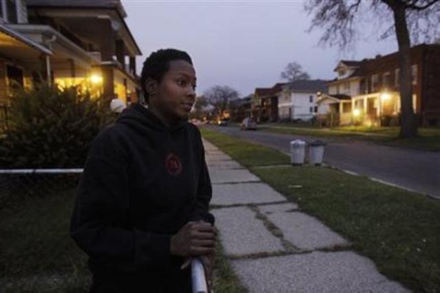 Much of Detroit's streets look like this one in Highland Park, which shows Cassandra Cabil at her home after Highland Park cut a deal with DTE to remove half the city's street lights. Under a new Public Lighting Authority, 40 percent of Detroit's street lights, many already gone, will also be permanently removed. The blame lies with Wall Street.