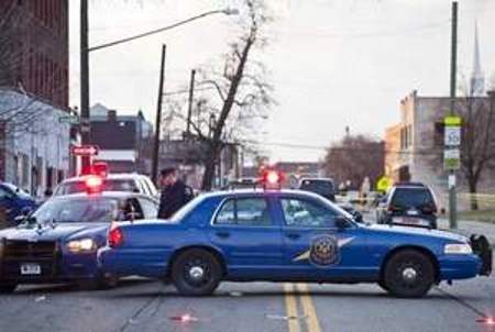 Detroit and state police cars at Linwood and Hooker April 2 after officers shot 23-year-old Matthew Joseph to death under suspicious circumstances. Media reports indicated "friendly fire" was involved in the shooting of one cop, and that Joseph was being pursued as a suspect in the killing of another cop's drug-dealer son. Neighbors say at least 20 poice cars came to the area, that there were three people in the car who remained motionless for the two hours they watched them. The driver Matthew Joseph was slumped over the steering wheel and did not appear to have exited the car. VOD is investigating further.