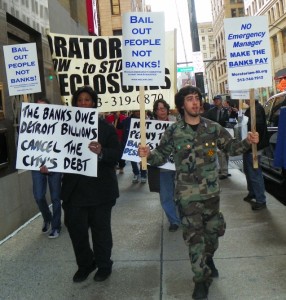 Protesters in downtown Detroit demand cancellation of Detroit's debt to banks.