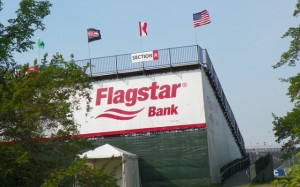 Flagstar Bank, one of many banks and corporations sponsoring the Detroit Belle Isle Grand Prix. Flagstar put Jennifer Britt among thousand of others out of their homes, and was featured in protest signs at the May 4 rally for a moratorium on Detroit's debt to the banks.