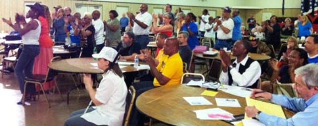 Crowd applauds testimony from S. Baxter Jones at Metro Detroit hearing against foreclosures May 20, 2013.