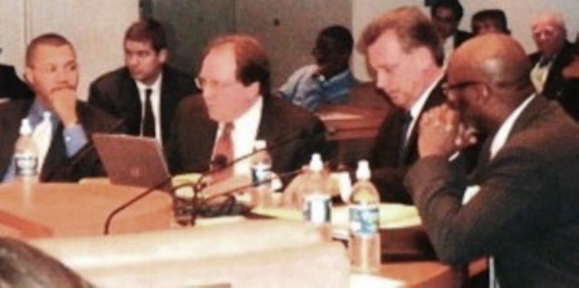 Joe O'Keefe of Fitch Ratings and Stephen Murphy of Standard and Poor's (center) at City Council table Jan. 2005, Also present, KIlpatrick's CFO Sean Werdlow (l) and Deputy Mayor Anthony Adams (r). Photo by Diane Bukowski
