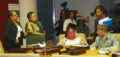 Council Member JoAnn Watson (center) with her staff members (l) Debra Taylor and Monica Patrick, consults with Council Members Brenda Jones and Kwame Kenyatta after the Council's 5-4 vote for the sell-out Consent Agreement April 4, 2012.