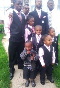 Charles Jones, little sons, and family members before Aiyana's funeral.