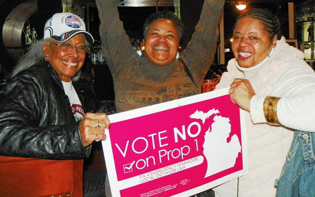 Chris Griffith, Monica Lewis-Patrick and Sandra Hines celebrate the defeat of Public Act 4 at the polls Nov. 6, 2012.