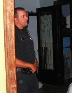 Detroit cop Kevin Simpson, one of three who broke down her side door in March, 2011, at belated evidentiary search for bullet hole Aug. 20, 2011.