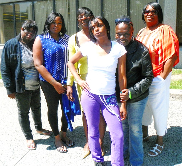 Dominika Stanley (front) with relatives and friends before mistrial was declared.
