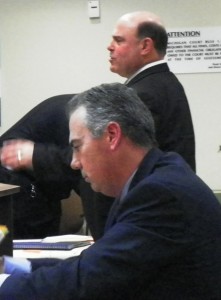 Prosecutor Robert Moran (seated) at preliminary exam of Aiyana's father Charles Jones as Jones' attorney Leon Weiss speaks, Jan. 26, 2012. Photo by Diane Bukowski