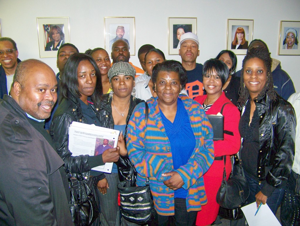Kevin Carey (l), organizer of People's Task Force, with family members of prisoners wrongly incarcerated due to crime lab errors, after City Council hearing May 11, 2009.