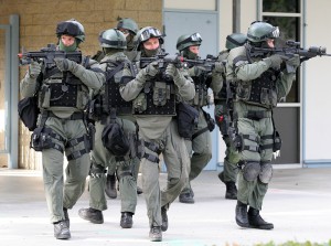 Members of the San Diego County Sheriff's Department Special Enforcement Detail move onto Poway's Abraxas High School's grounds in a "Lockdown and Active Shooter Response" simulation on Wednesday.