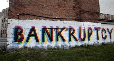 Someone painted "Bankruptcy" on wall of building on Grand River near I-75. The letters are in black, green and red, colors of the Black nation.