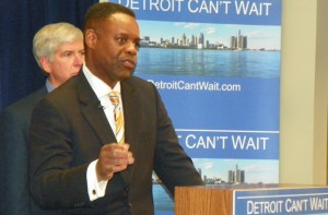 Detroit EM Kevyn Orr at press conference announcing his appointment by Gov. Rick Snyder (in background).