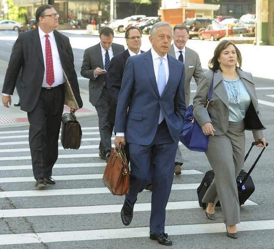 Heather Lennox leads Jones Day's victorious charge out of court July 24.. Beside her is Jones Day Attorney Stephen Heiman and in background at right is managing partner Stephen Brogan.