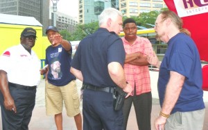 Jerry Bell's supporters Ron Holland (2nd from l) and John Telford (r), speak out in his support to police.