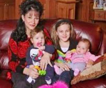Ingham County Circuit Court Judge Rosemarie Aquilina with three of her five children.