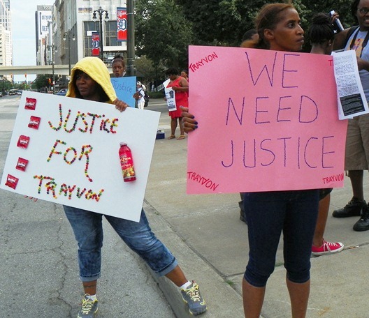 One marcher carried a sign fashioned with Skittles and a pop bottle, the items Trayvon was carrying when he was murdered by George Zimmerman.