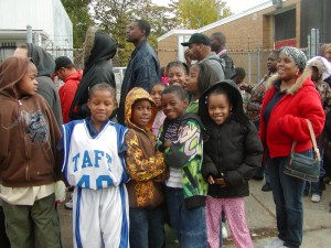 Detroit children wait in line for free coats at Moorish Science Temple of America giveaway.