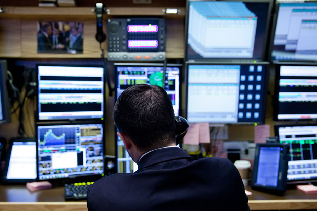 Trader works on floor of U.S. stock exchange.