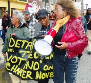 Objector Dempsey Addison (r) with (l to r) Chris Griffith and Cecily McClellan at first Occupy Detroit march in 2011.