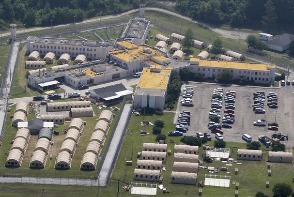 Temporary structures are constructed around a building at Angola State Penitentiary in West Feliciana Parish, La., Monday, May 9, 2011. A convoy of buses and vans transferred inmates with medical problems from Angola, which is bordered on three sides by the Mississippi River, while other inmates were moved to buildings on higher ground as part of an effort to prepare for possible flooding. (AP Photo/Patrick Semansky) Read more: http://www.kitsapsun.com/photos/2011/may/09/197608/#ixzz2gaDNAxZu  Follow us: @KitsapSun on Twitter | KitsapNews on Facebook