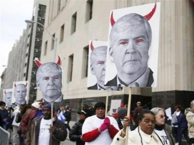 Protesters outside federal court in downtown Detroit during Mich. Gov. Rick Snyder's testimony at Detroit bankruptcy trial.