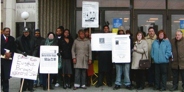 Members of the Original Detroit Coalition against Police Brutality, including Herman Vallery (2nd from left) and Arnetta Grable (6th from left), outside Frank Murphy Hall.