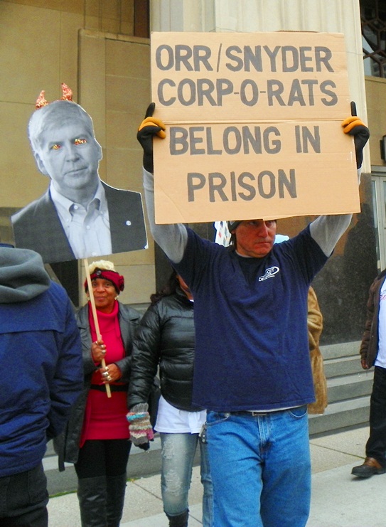Protesters outside courthouse demand prison for top criminals.