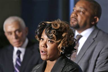 Monica McBride (center) and Walter Ray Simmons, Renisha McBride's parents, speak at press conference as family attorney Gerald Thurswell listens. Photo: Carlos Osorio/AP: