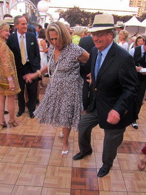 Noreen and Kenneth Buckfire square-dancing at event in NYC they chaired: "New York New York's a Wonderful Town." No wonder--Wall Street's there.