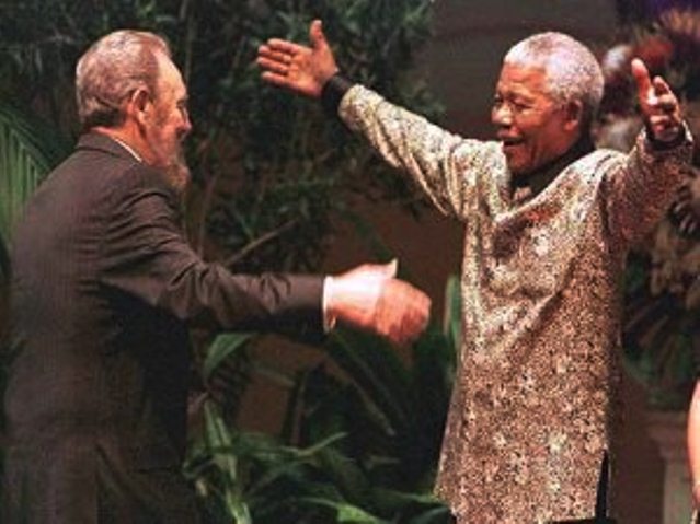 Nelson Mandela and Fidel Castro meet in Durban in 1998 for Non-Aligned Movement Summit. 