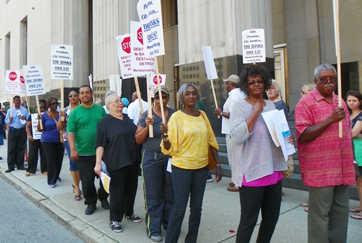 Detroit retirees protest outside bankruptcy hearing.