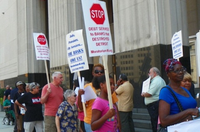 Detroit city retirees and their supporters protest outside bankruptcy hearing Aug. 19, 2013.