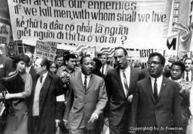 Dr. Martin Luther King, Jr. marches against genocidal U.S. war on Vietnam.