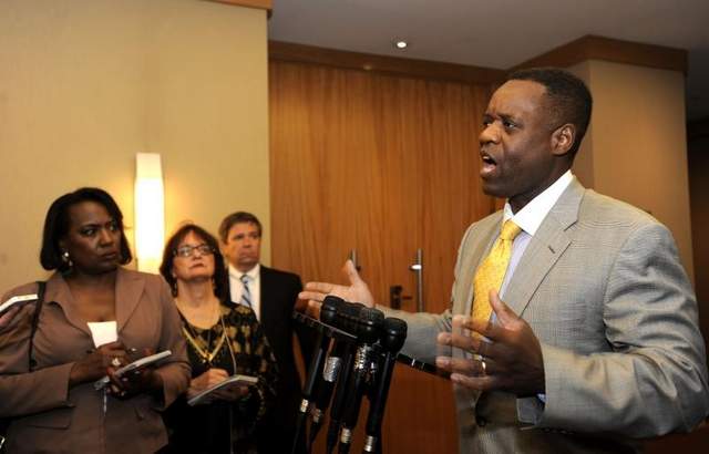 (L to r) Jounalists Vickie Thomas of WWJ and Diane Bukowski of Voice of Detroit question Kevyn Orr after meeting with creditors June 14, 2013.