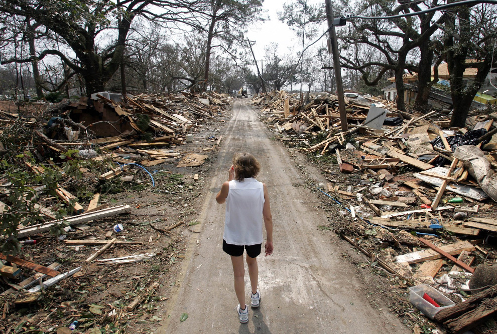 Little girl in shock after the destruction Hurricane Katrina wrought on New Orleans. A good number of Detroit's neighborhoods resemble this photo now after massive illegal foreclosures and evictions by the banks.