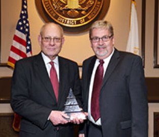Michael Sapala (l), retired judge, receives Pioneer of Justice award from Don Johnson, Chief State Defender for Legal Aid and Defender Association. John Meiu/Photographer
