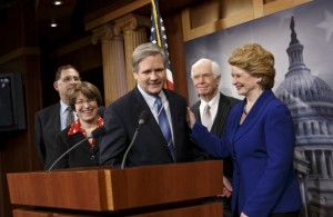 Senate Agriculture Committee Chairwoman Debbie Stabenow, D-MI, right, Thad Cochran, R-MS, second from right, and Senator John Hoeven, R-ND, center, just after Congress gave its final approval to the sweeping five-year farm bill, Tuesday, February 4, 2014. At left are Senator John Boozman, R-Ark., and Senator Amy Klobuchar, D-MN.  (AP Photo/J. Scott Applewhite)