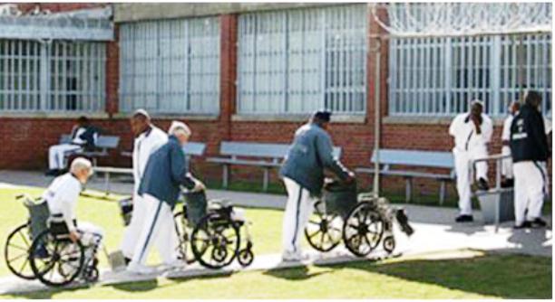 Prisoners being wheeled back into geriatric unit.