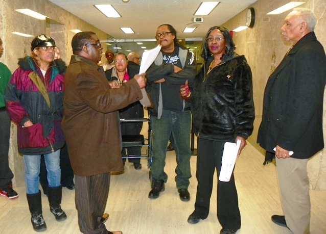Griswold tenant James McNeal discusses outcome of City Council meeting with other tenants Feb. 20, 2014.