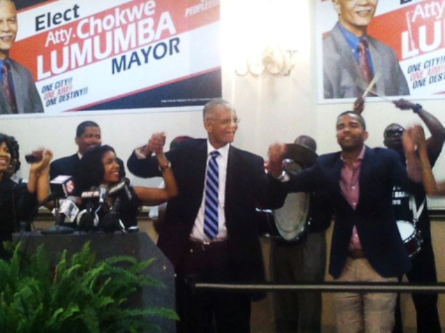 Mayor Chokwe Lumumba celebrates election victory June 5, 2013 with his daughter Rukia at his right and son Chokwe Antar at right. There is a move on to have his son replace him as mayor.